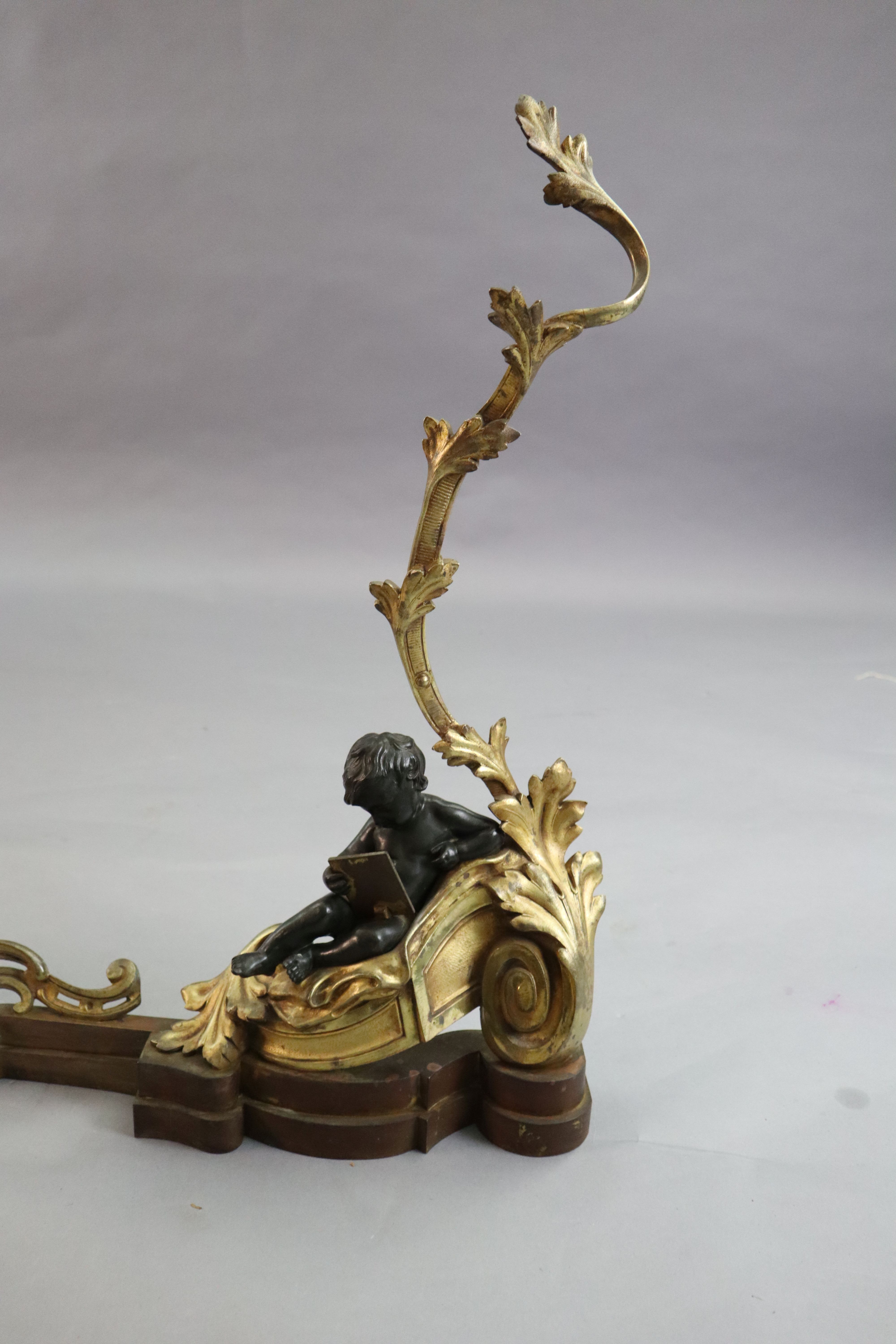 A Louis XVI style bronze and ormolu fender, length 48in. height 24in.
